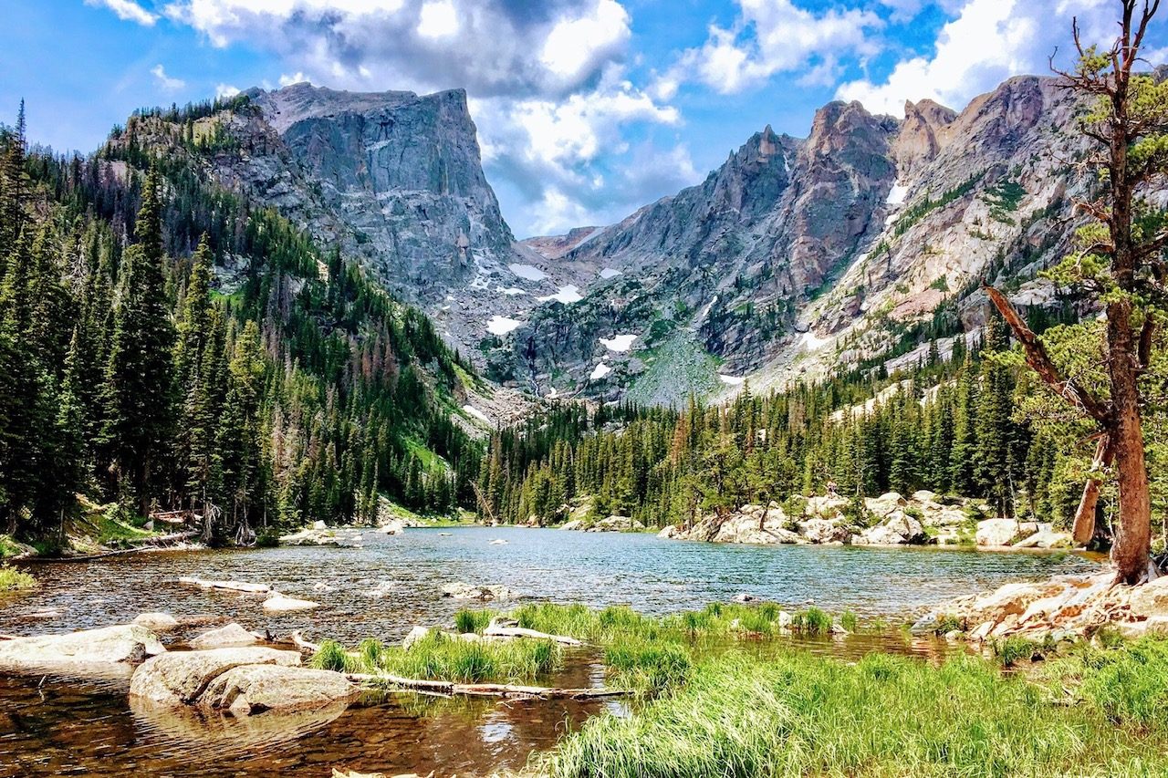 Alpine lake beneath granite peaks and evergreen forest